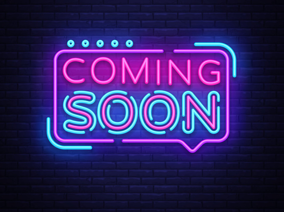neon sign with words coming soon