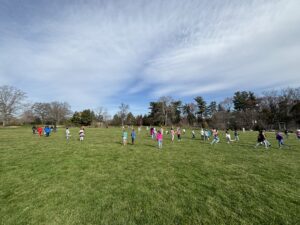 3 of the third grade classes on a field trip to the Green Springs Garden running around before the field trip began.